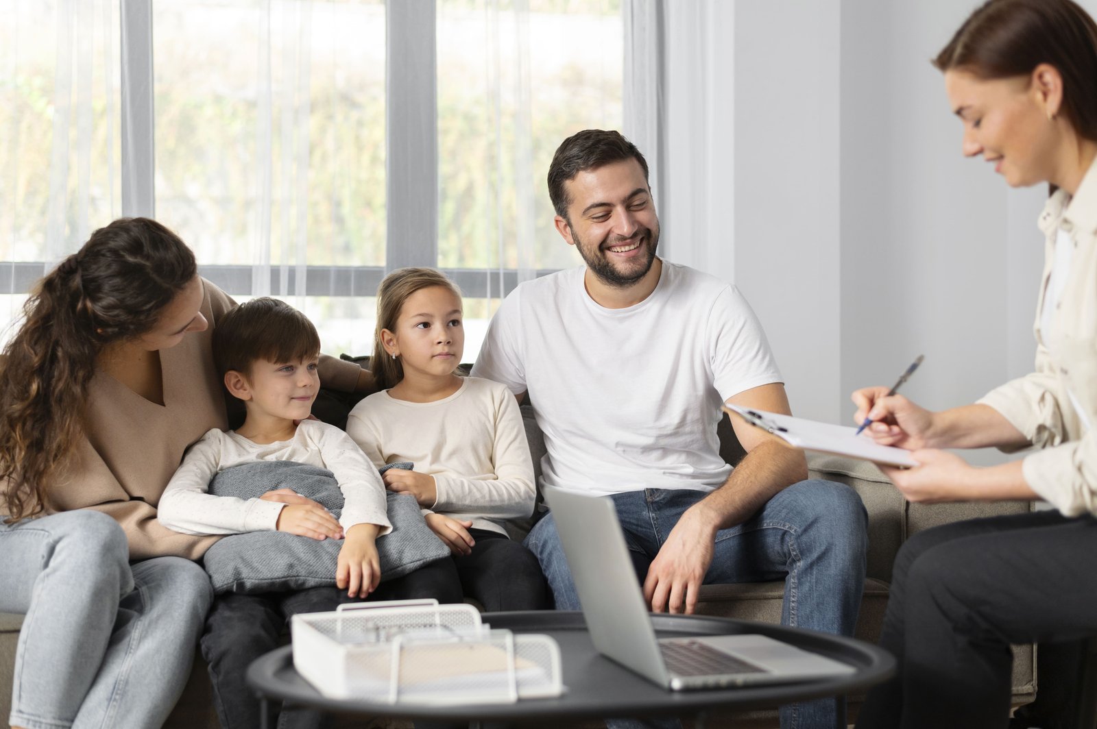 child,Adolescent discussing concerns with therapist during counselling session